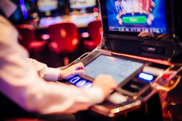 A young woman relaxing with her phone while dynamic casino elements float around her, illustrating the smooth mobile experience offered by the 7000BET app.