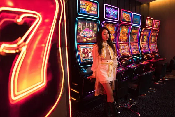 A confident dealer surrounded by casino chips inviting players to access their 7000BET account, reflecting quick and easy login options.